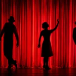 Acting coach helping performers build confidence and stage presence during a theater rehearsal.